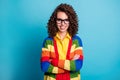 Portrait of curly brunette hair girl confident happy smile success crossed hands isolated over blue color background