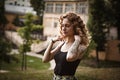 Portrait of curly-haired woman on the street