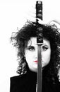 Portrait curly woman curly girl and sword