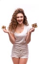 Portrait of curly young woman eating a chocolate bar Royalty Free Stock Photo