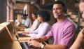Portrait Of Customer Support Or Telesales Team In Modern Open Plan Office Wearing Headsets Royalty Free Stock Photo