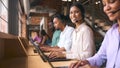 Portrait Of Customer Support Or Telesales Team In Modern Open Plan Office Wearing Headsets Royalty Free Stock Photo