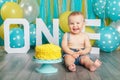 Caucasian baby boy celebrating his first birthday. Cake smash Royalty Free Stock Photo