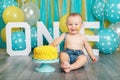 Caucasian baby boy celebrating his first birthday. Cake smash Royalty Free Stock Photo