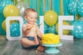 Caucasian baby boy celebrating his first birthday. Cake smash Royalty Free Stock Photo