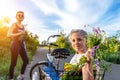 Portrait cute adorable caucasian blond little girl enjoy having leisure fun riding bicycle with family holding wild Royalty Free Stock Photo