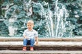 Portrait of cute adorable funny Caucasian little boy toddler in white shirt and blue jeans Royalty Free Stock Photo