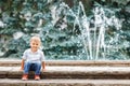 Portrait of cute adorable funny Caucasian little boy toddler in white shirt and blue jeans Royalty Free Stock Photo