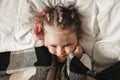 Portrait of cute adorable smiling little girl waking up and stretching in her bed Royalty Free Stock Photo