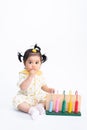 Portrait of cute asian baby girl with toy isolated