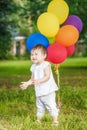 Portrait of cute Asian child with balloons clapping her hands Royalty Free Stock Photo