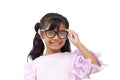 Portrait cute Asian little girl wearing glasses looking and smile on white background. Royalty Free Stock Photo