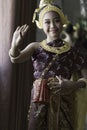 A portrait of a cute Asian schoolgirl dressed in a traditional Thai dress performing a Thai traditional dance Royalty Free Stock Photo