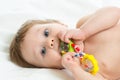 Portrait of a cute baby boy playing with teething toy Royalty Free Stock Photo