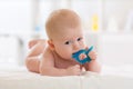 Portrait of a cute baby boy playing with teething toy Royalty Free Stock Photo