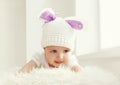 Portrait of cute baby in white knitted hat with ears rabbit Royalty Free Stock Photo