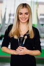 Portrait of a cute beautiful girl mekeup artist natural with long hair blond. In the studio, anti gravity fitness yoga . Royalty Free Stock Photo