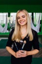 Portrait of a cute beautiful girl mekeup artist natural with long hair blond. In the studio, anti gravity fitness yoga . Royalty Free Stock Photo