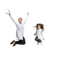 Portrait of cute beautiful little girl, child in image of nurse and female doctor jumping isolated on white studio