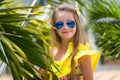 Portrait of a cute beautiful smiling girl in sunglasses on vacation