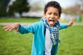 Portrait of a cute black boy making faces and showing his tongue Royalty Free Stock Photo