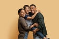 Portrait of cute black family posing together on colored background Royalty Free Stock Photo