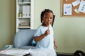 Child holding crayon and looking at camera Royalty Free Stock Photo