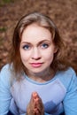 Portrait of cute blonde girl in blue dress outdoors. Nice woman posing on nature landscape Royalty Free Stock Photo