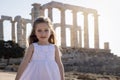 Portrait of a cute, blonde girl in a white summer dress Royalty Free Stock Photo