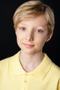 Portrait of cute boy black background posing for the camera