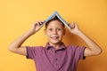 Portrait of cute boy with book on background. Reading concept Royalty Free Stock Photo