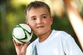 Boy holding small handball.