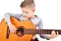 Portrait of a cute boy playing acoustic guitar Royalty Free Stock Photo