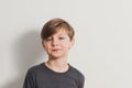 A portrait of cute boy pulling faces, snooty look Royalty Free Stock Photo