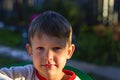 Portrait of a cute boy at sunset