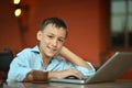 Portrait of cute boy using laptop computer Royalty Free Stock Photo