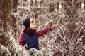 Portrait cute boy in warm winter forest Royalty Free Stock Photo