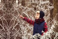 Portrait cute boy in warm winter forest Royalty Free Stock Photo