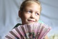 Portrait - cute on bright background little girl with a fan Royalty Free Stock Photo