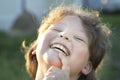 Portrait of a cute caucasian boy smiling summer outdoors, laughing children