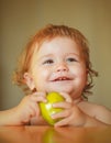 Portrait of cute Caucasian child kid with apple. Kid with fresh fruit. Royalty Free Stock Photo