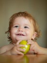 Portrait of cute Caucasian child kid with apple. Kid with fresh fruit. Royalty Free Stock Photo