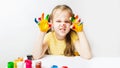 Portrait Cute caucasian preschool little girl with face and hands painted at home Royalty Free Stock Photo