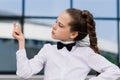 Portrait of cute caucasian teen girl holding coin. Saving money concept