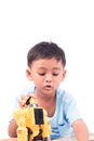 Portrait of cute child asian little boy playing robot