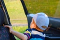 Portrait cute child boy sitting in car seat. Child transportation safety Royalty Free Stock Photo