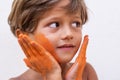 Portrait of child with colors in the face.