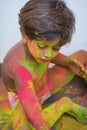 Portrait of child with colors in the face.