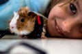 Portrait Cute child with his funny pet guinea pig Royalty Free Stock Photo