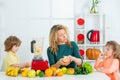 Portrait of cute family is making fruit juice. on white kitchen. Healthy food at home. Royalty Free Stock Photo